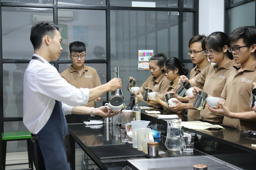 Trainer leading a workshop session with production staff